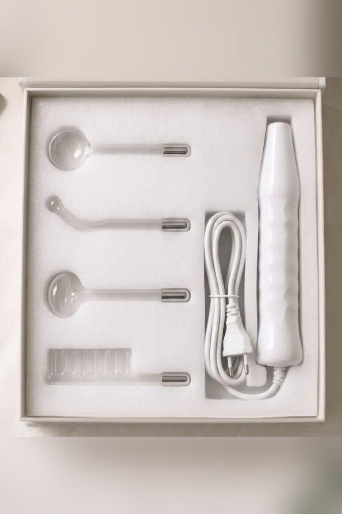 Kit SkinPulsePro completo en su caja con mango, cable y 4 electrodos